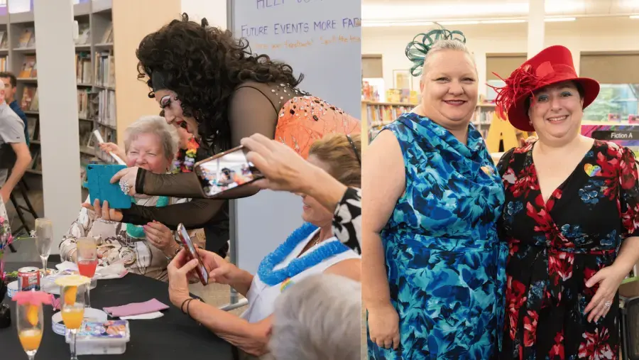 Guests take photos with a performer in an orange dress, while two attendees in colorful dresses and decorative hats pose together for a photo.