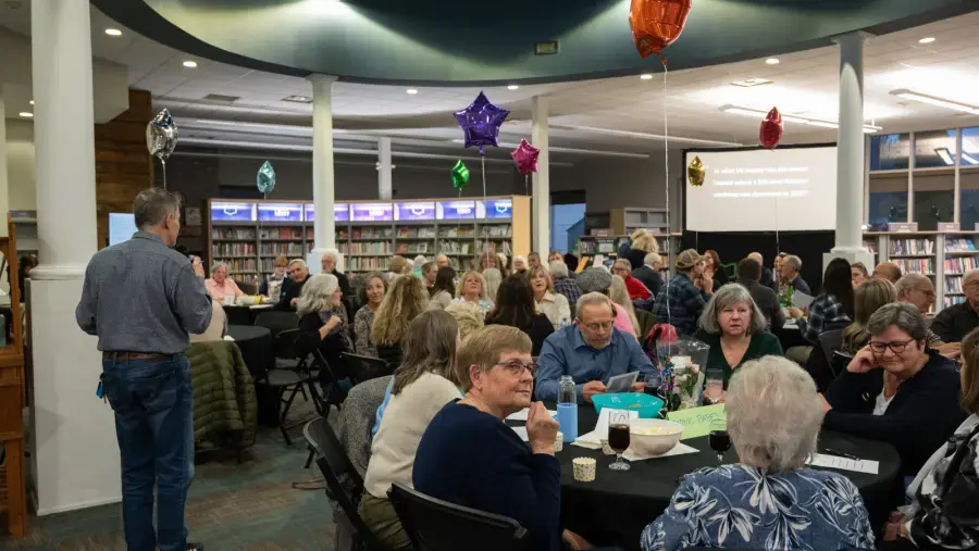 Trivia Night host, Mike Balsom reads out a question to participants.